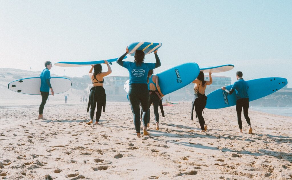 Aus Surf Report | Group of People Carrying Surfboards