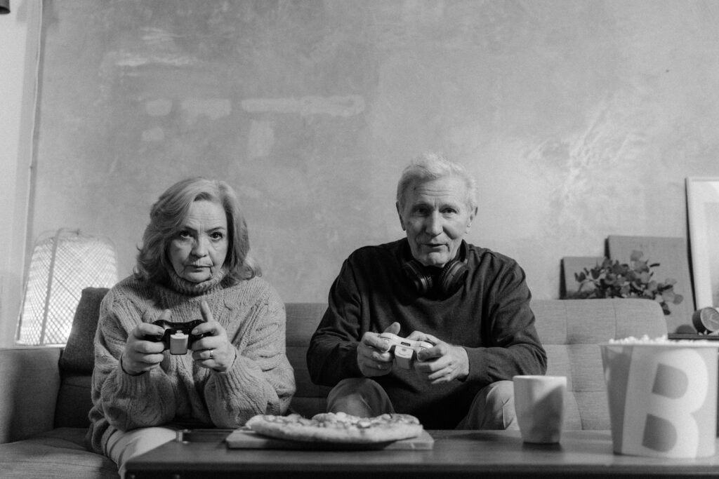 Algorithma | Grayscale Photo of Elderly Man and Woman Playing Video Games