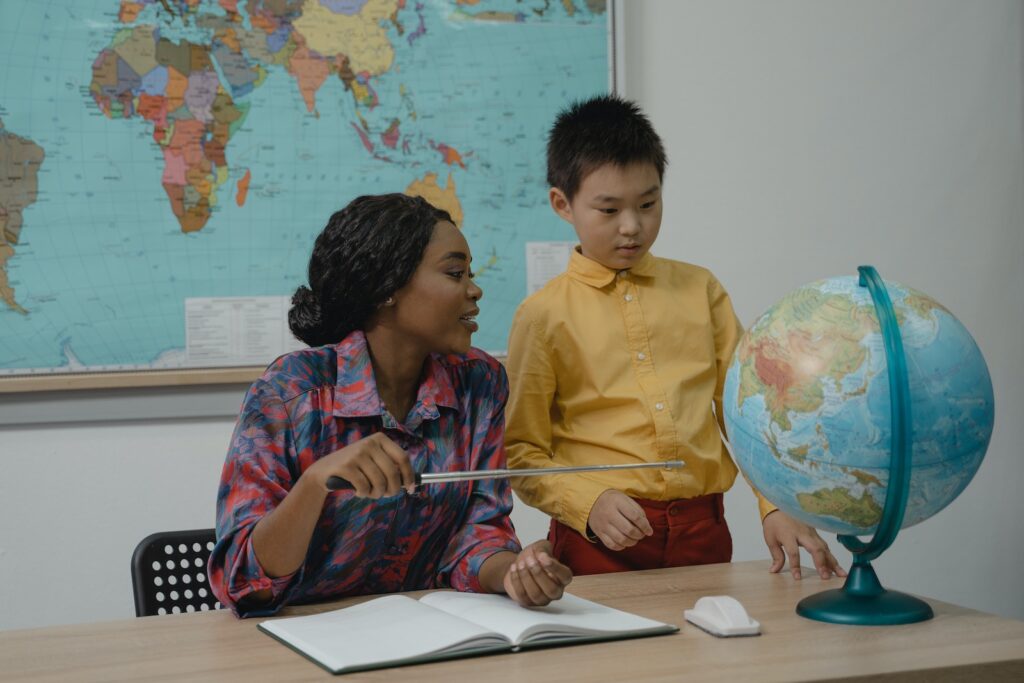 AmazingTalker | Teacher Pointing at a Globe using a Pointer